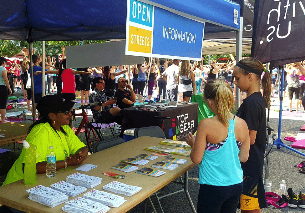 Assistant at an event and speaking with people